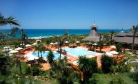 an aerial view of a resort with a pool and the ocean at Royal Hideaway Sancti Petri in Chiclana de la Frontera