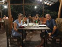 Un hombre y una mujer sentados en una mesa en Bundala Flamingo Cotteges, en Hambantota