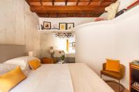 A bed or beds in a room at Giulia Luxury Suite