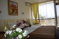 A bed or beds in a room at Sunshine Pearl Family Hotel