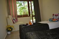 A bed or beds in a room at Sunshine Pearl Family Hotel