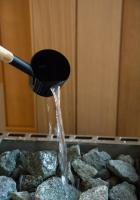 a stream of water pouring from a spatula into rocks at Atypik Hotel in Clichy