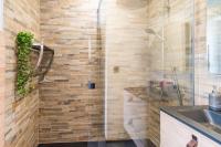 a bathroom with a shower and a sink at L&#39;Escale Paimpolaise 2 Étoiles - centre historique in Paimpol