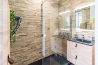 a bathroom with a sink and a shower at L&#39;Escale Paimpolaise 2 Étoiles - centre historique in Paimpol