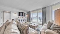 ein Wohnzimmer mit Couch und Blick aufs Meer in der Unterkunft St Maarten 907 a Newly Renovated Luxury Beach Front 3 Bedroom 9th Floor Private Elevator in Destin