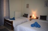 A bed or beds in a room at Deppy's House κοντά στα λουτρά Πόζαρ
