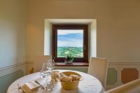 a dining room with a table and a window at Palazzo Riccucci in Montappone