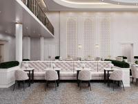 a lobby with a large couch and tables and chairs at HOTEL KARVON SHAHRISABZ in Shahrisabz