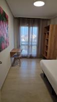 A bed or beds in a room at Apartamentos Gran Socaire de Noja