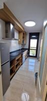 A kitchen or kitchenette at Apartamentos Gran Socaire de Noja