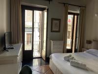 Posteľ alebo postele v izbe v ubytovaní C&O Savoia Deluxe Rooms