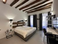 Posteľ alebo postele v izbe v ubytovaní C&O Savoia Deluxe Rooms