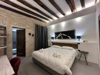 Posteľ alebo postele v izbe v ubytovaní C&O Savoia Deluxe Rooms