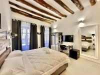 Posteľ alebo postele v izbe v ubytovaní C&O Savoia Deluxe Rooms