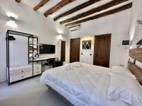 Posteľ alebo postele v izbe v ubytovaní C&O Savoia Deluxe Rooms