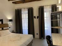 Posteľ alebo postele v izbe v ubytovaní C&O Savoia Deluxe Rooms