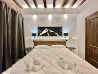 Posteľ alebo postele v izbe v ubytovaní C&O Savoia Deluxe Rooms
