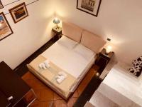 Posteľ alebo postele v izbe v ubytovaní C&O Savoia Deluxe Rooms