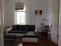 a living room with a couch and a table at Villa Peppina Apartment in Lovran