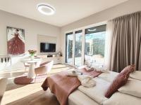Televízia a/alebo spoločenská miestnosť v ubytovaní Spa Residence Carbona Mona Lila Apartman