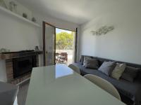 A seating area at Acogedor apartamento con piscina comunitaria, cerca de la playa de Sa Tuna - ES-226-26