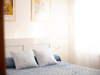 A bed or beds in a room at Alojamiento Turistico Zamora 58
