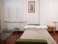 A bed or beds in a room at Alojamiento Turistico Zamora 58