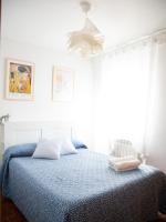 A bed or beds in a room at Alojamiento Turistico Zamora 58
