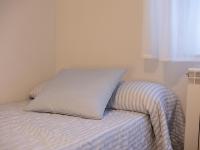 A bed or beds in a room at Alojamiento Turistico Zamora 58