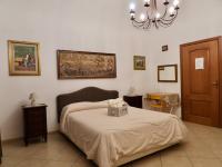 Posteľ alebo postele v izbe v ubytovaní B&B Maria Piddu