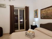 Posteľ alebo postele v izbe v ubytovaní B&B Maria Piddu