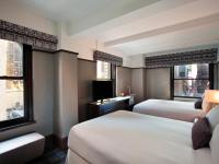 Ein Bett oder Betten in einem Zimmer der Unterkunft Park Central