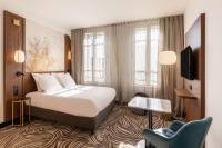 Hôtel Apollinaire Niceにあるベッド