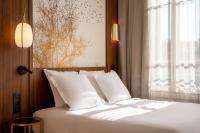 Hôtel Apollinaire Niceにあるベッド