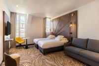 Hôtel Apollinaire Niceにあるベッド
