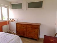 a bedroom with a wooden dresser next to a bed at Appart T3 Spacieux + Terrasse in Montpellier