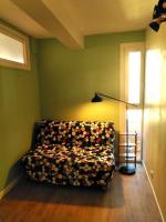 a room with a couch in a room with a window at Appart T3 Spacieux + Terrasse in Montpellier