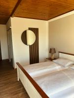 Postel nebo postele na pokoji v ubytování Hotel Leo