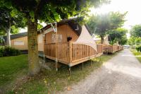 a house with a porch with a teepee on it at Glamping Bretagne in Quimper