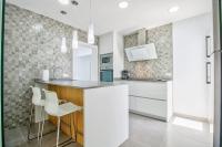 A kitchen or kitchenette at Assimetric by Rentallorca