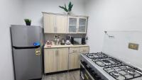 Kuchyň nebo kuchyňský kout v ubytování Madinaty apartment 1 شقة فندقية مفروشة سوبر لوكس في مدينتي