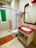a bathroom with a red sink and a toilet at 悅庭民宿 in Zhixue
