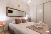 a bedroom with a large bed with towels on it at MBA - Splendide Appart - Gambey 1 - Proche République in Paris