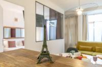 a model of the eiffel tower sitting on a table at MBA - Splendide Appart - Gambey 1 - Proche République in Paris