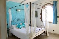 Posteľ alebo postele v izbe v ubytovaní Agriturismo Suite del Conte
