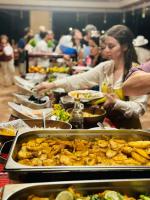 a buffet line with many plates of food at Wadi Rum Desert Tours and Glamping with Hussein in Wadi Rum
