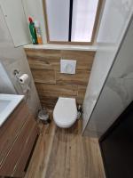 a small bathroom with a toilet and a window at L&#39;écrin du Cap Esterel in Saint-Raphaël