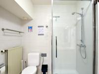 a bathroom with a toilet and a shower at Blomme 0202 exclusive apartment with sea view in De Haan