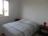 a white bedroom with a bed and a window at La casa en el campo A 20 minutes de Zoo Beauval &amp; 8 minutes de la flamme olympique à Valençay in Vicq-sur-Nahon