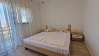 Posteľ alebo postele v izbe v ubytovaní Apartman LAURA 1